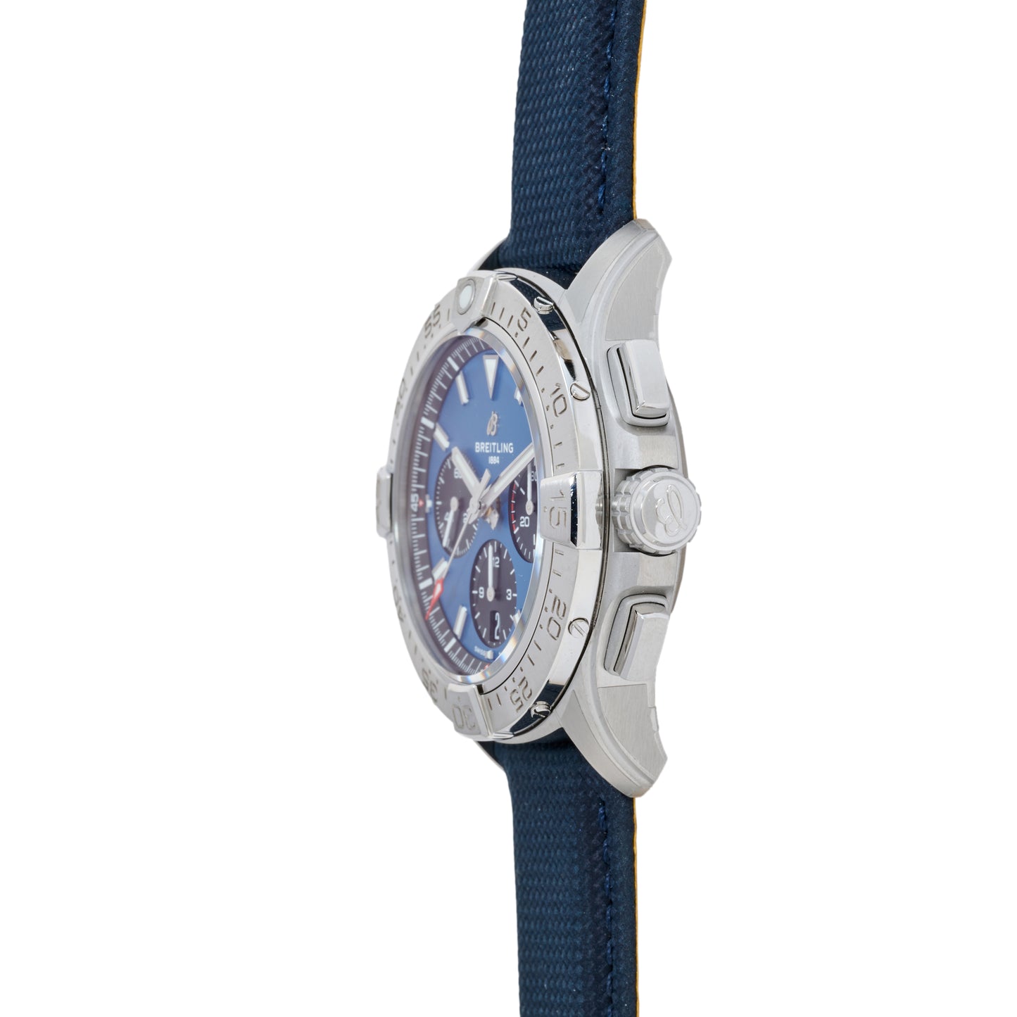 A side view of the Breitling Avenger B01 Chronograph 42 watch features a blue dial, silver bezel, and blue strap, highlighting the crown and polished case details.