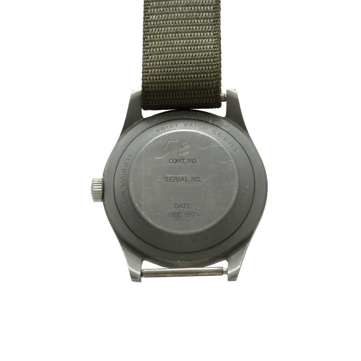 Hamilton GG-W-113 military watch with olive fabric strap, showing back case engraved with contract number and December 1974 d
