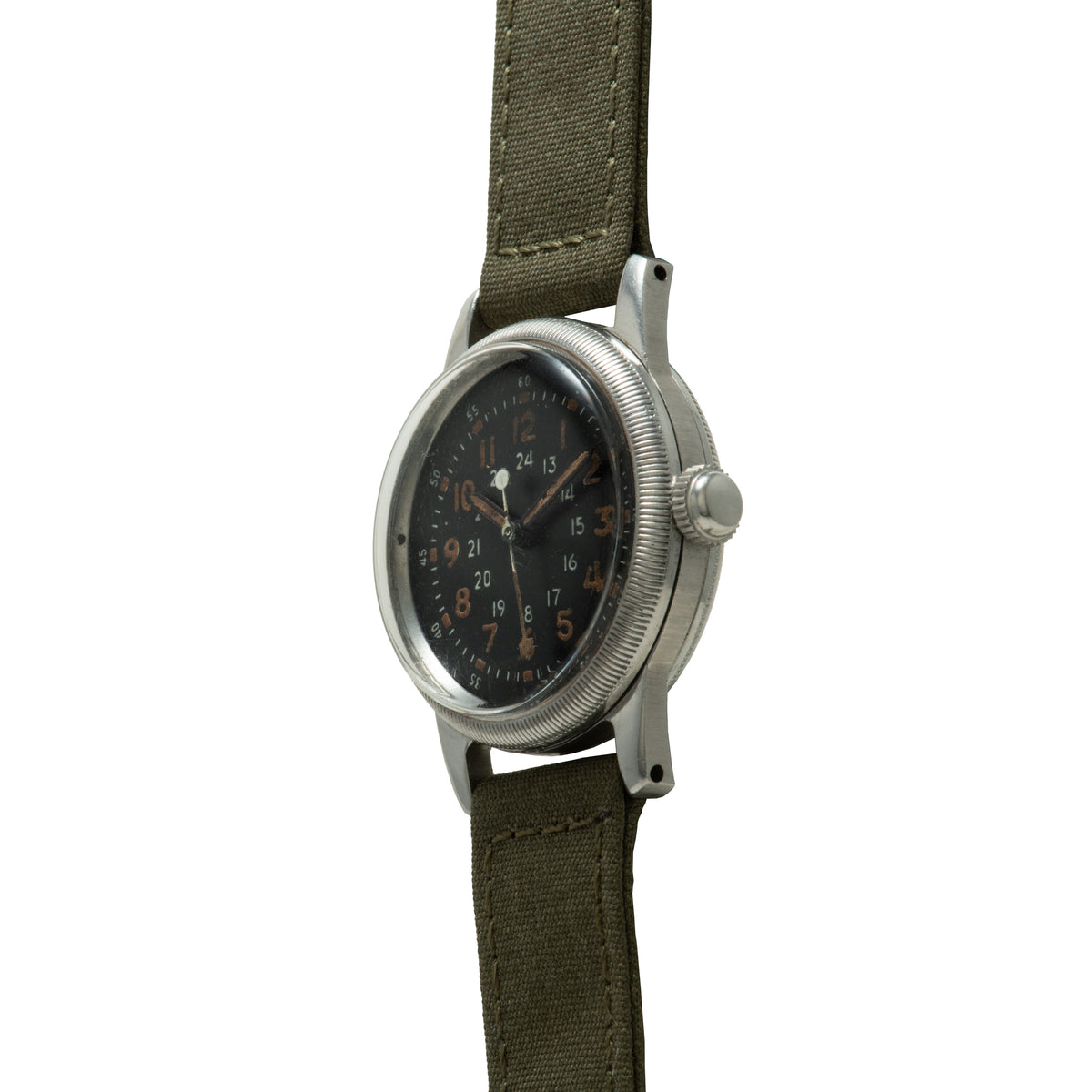 Waltham A-17 watch with black dial, 24-hour numerals, olive canvas strap, and brushed metal case.