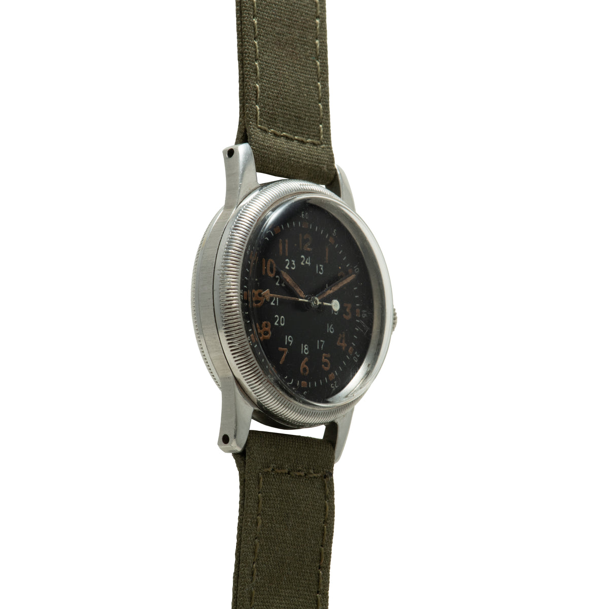 Waltham A-17 military watch with black dial, 24-hour markings, and olive canvas strap.