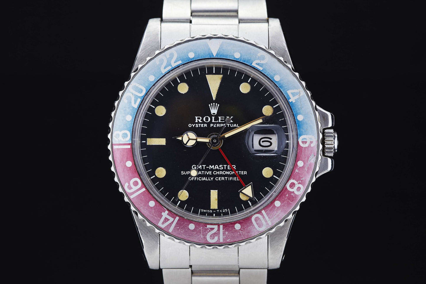 A close-up of the Rolex GMT Master 1675, featuring a stainless steel band, black dial, date window, and iconic red and blue bezel—an enduring favorite for Rolex collectors and everyday watch fans alike.