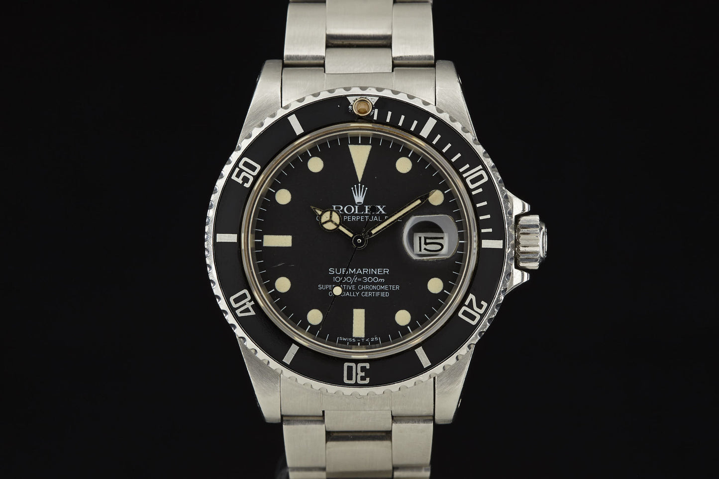 A close-up of the Rolex Submariner by Rolex, featuring a stainless steel case, black dial, white hour markers, rotating bezel, and date window at 3 o’clock, set against a sleek black background.