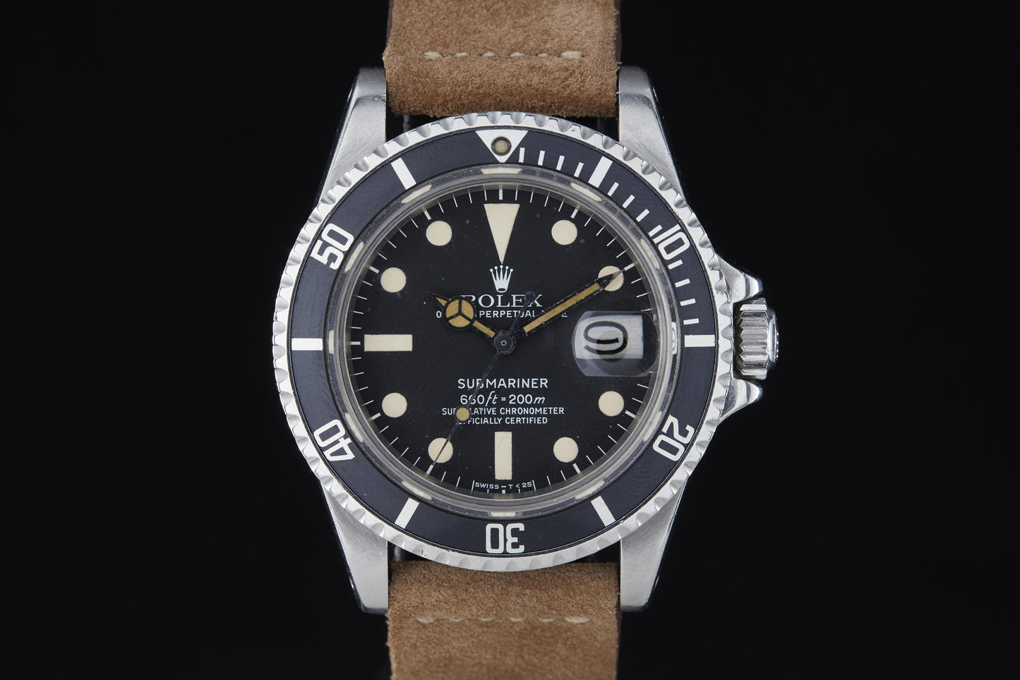 A close-up of a Rolex Submariner by Rolex, featuring a black dial with white markers, brown leather strap, date display, and rotating bezel, set against a black background.