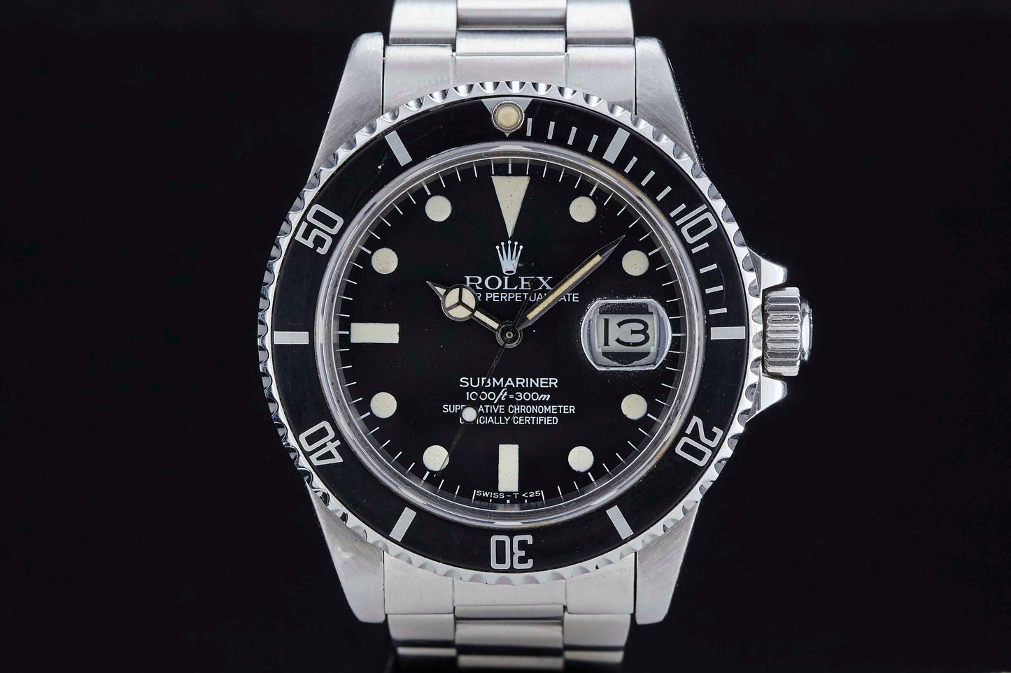 Close-up of the Rolex Submariner Date by Rolex, Ref. 1680, showcasing a black dial with white hour markers, date window at 3 o'clock, stainless steel bracelet, and a rotating bezel with minute markers.