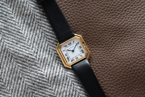 27 mm yellow-gold Ceinture with a gloss white Roman dial signed Paris at six and blued hands. · Photo: Analog:Shift · © Analog:Shift, used with permission · Source: https://www.analogshift.com/products/cartier-ceinture-paris-as09030