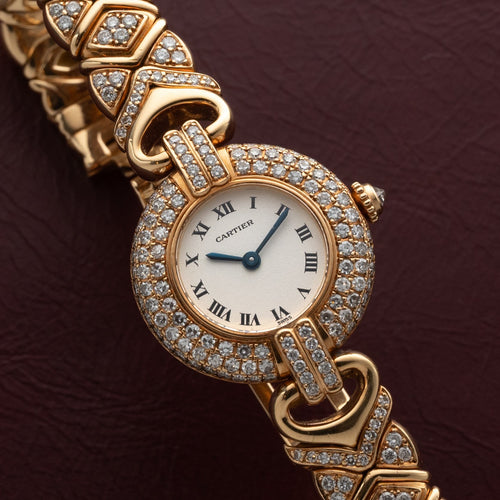 Yellow-gold Colisée with pavé diamond bezel, diamond-set links and bracelet, white Roman dial with blued hands. · Photo: Analog:Shift · © Analog:Shift, used with permission · Source: https://www.analogshift.com/products/cartier-colisee-as09782