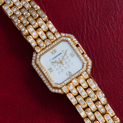 Fully diamond-set gold Ceinture with diamond-set bracelet and a mother-of-pearl dial set with diamonds. · Photo: Analog:Shift · © Analog:Shift, used with permission · Source: https://www.analogshift.com/products/cartier-ceinture-paris-diamond-as09788