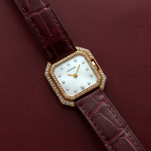 Diamond-set gold Ceinture with a mother-of-pearl dial and diamond indexes, on a burgundy strap. · Photo: Analog:Shift · © Analog:Shift, used with permission · Source: https://www.analogshift.com/products/cartier-ceinture-diamond-as09801