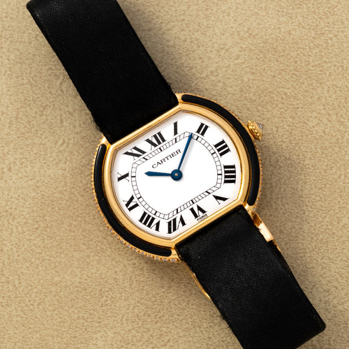 Gold Ellipse Gondole with factory onyx inlays and diamonds around a white Paris Roman dial. · Photo: Analog:Shift · © Analog:Shift, used with permission · Source: https://www.analogshift.com/products/cartier-ellipse-gondole-as10100