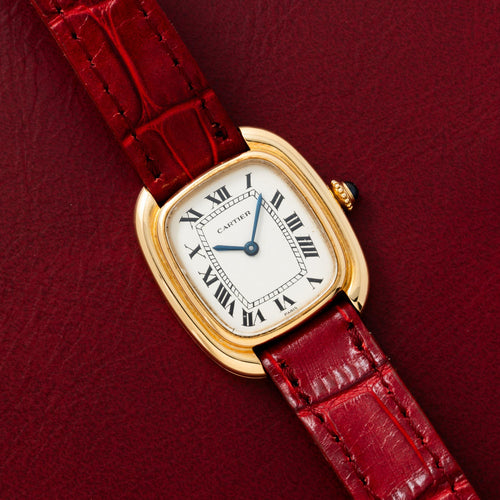 Lady's Gondole in yellow gold with white Paris Roman dial with railway track and blued hands. · Photo: Analog:Shift · © Analog:Shift, used with permission · Source: https://www.analogshift.com/products/cartier-gondole-ladies-as10150