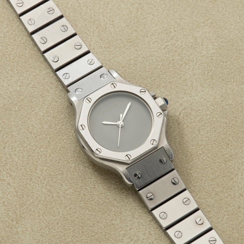 Lady's 25 mm steel Santos Octagon with a plain matte grey dial without hour markers and steel hands, the octagonal 'Ghost' dial. · Photo: Analog:Shift · © Analog:Shift, used with permission · Source: https://www.analogshift.com/products/cartier-santos-octagon-as10194