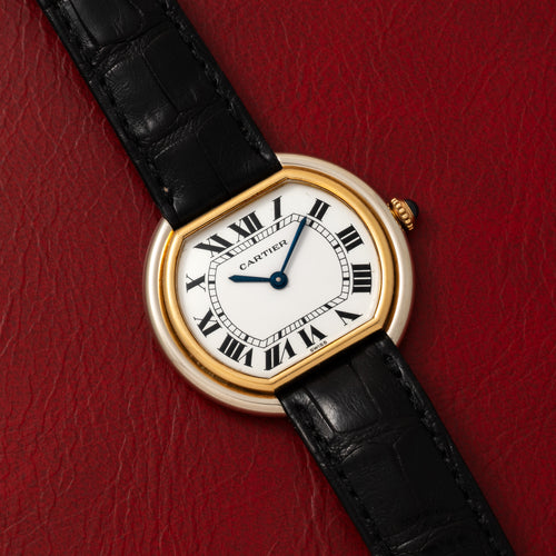 33 mm Ellipse in yellow and white gold with a white Roman dial and blued sword hands. · Photo: Analog:Shift · © Analog:Shift, used with permission · Source: https://www.analogshift.com/products/cartier-ellipse-two-tone-white-and-yellow-gold-as11225