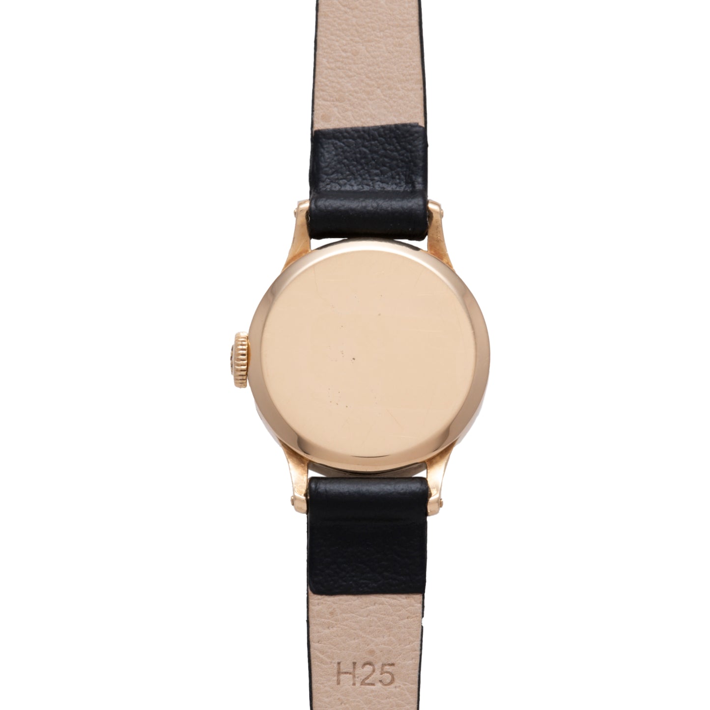 The Patek Philippe Calatrava 'Tiffany & Co' ladies dress watch features a gold case and black and beige leather strap, shown from the back with "H25" stamped inside, embodying timeless elegance.