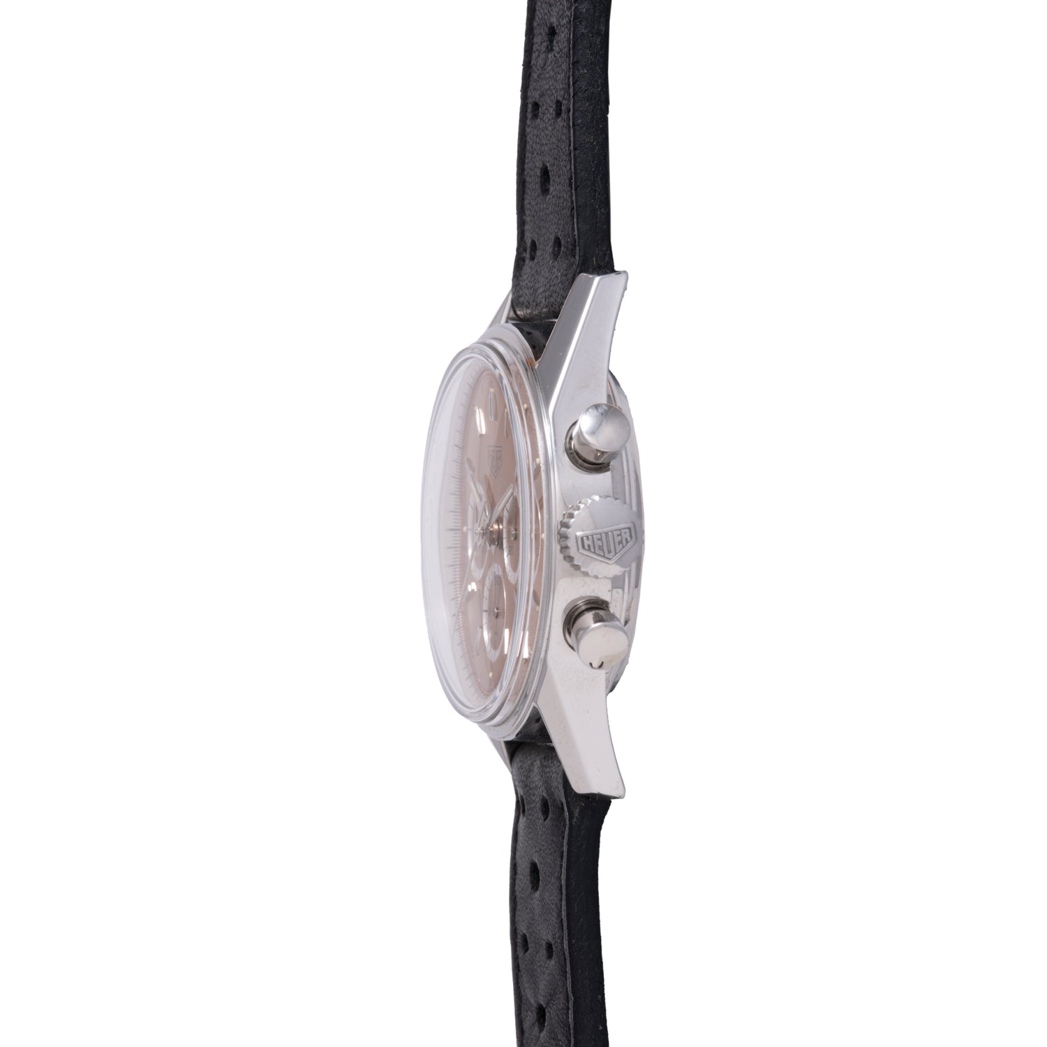 Side view of the TAG Heuer 1964 Carrera Re-Edition, a silver round chronograph with two pushers, crown showing the TAG Heuer logo, and a perforated black leather strap—classic vintage-inspired style.
