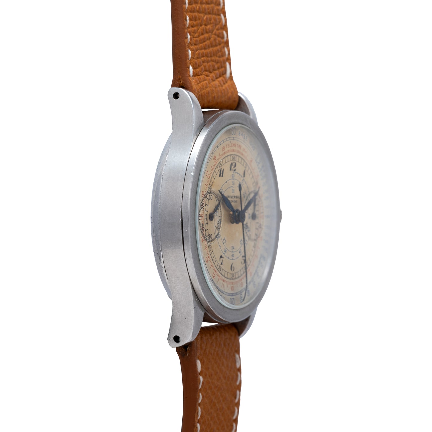 The Universal Genève Compax 'Breguet' vintage chronograph by Universal Geneve features a brown leather strap, silver-tone case, off-white dial with Roman numerals, two subdials, and blue hands, shown from a side view.