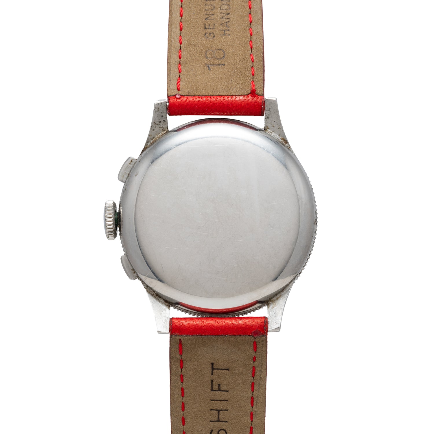 The Benrus Sky Chief features a round, plain silver case displayed vertically on the back, paired with a tan leather strap with red edges and stitching, echoing the classic pilot style of traditional Benrus watches.