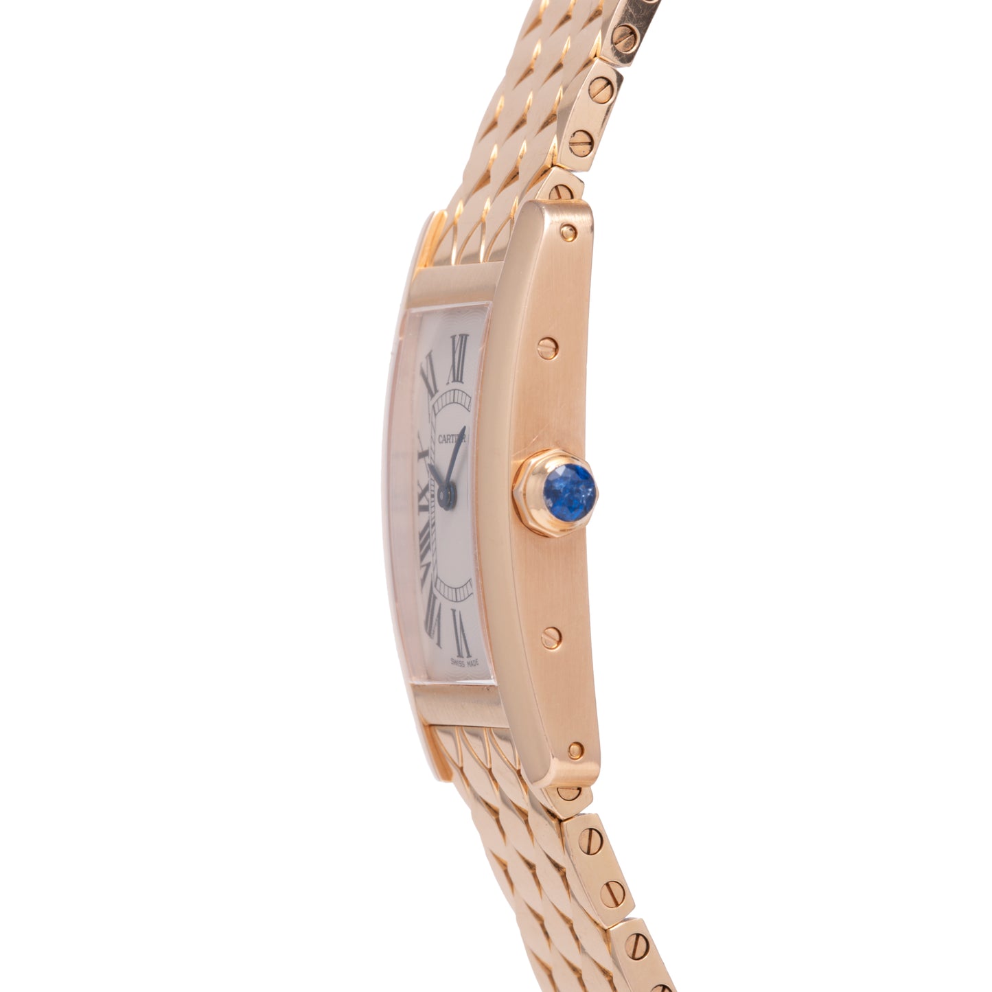 A close-up side view of the Cartier Tank Americaine by Cartier, a ladies’ 18K rose gold watch featuring a silver guilloché dial with Roman numerals, blue gemstone crown, and gold link bracelet.