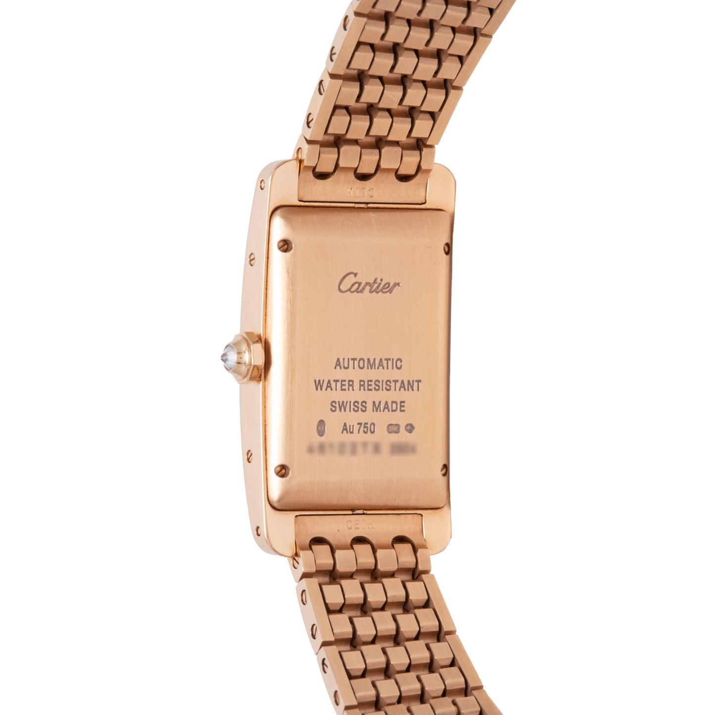 The back of a Cartier Tank Americaine Automatic Diamonds watch in 18K rose gold with a metal link band, engraved with Cartier, Automatic, Water Resistant, Swiss Made, and AU 750.