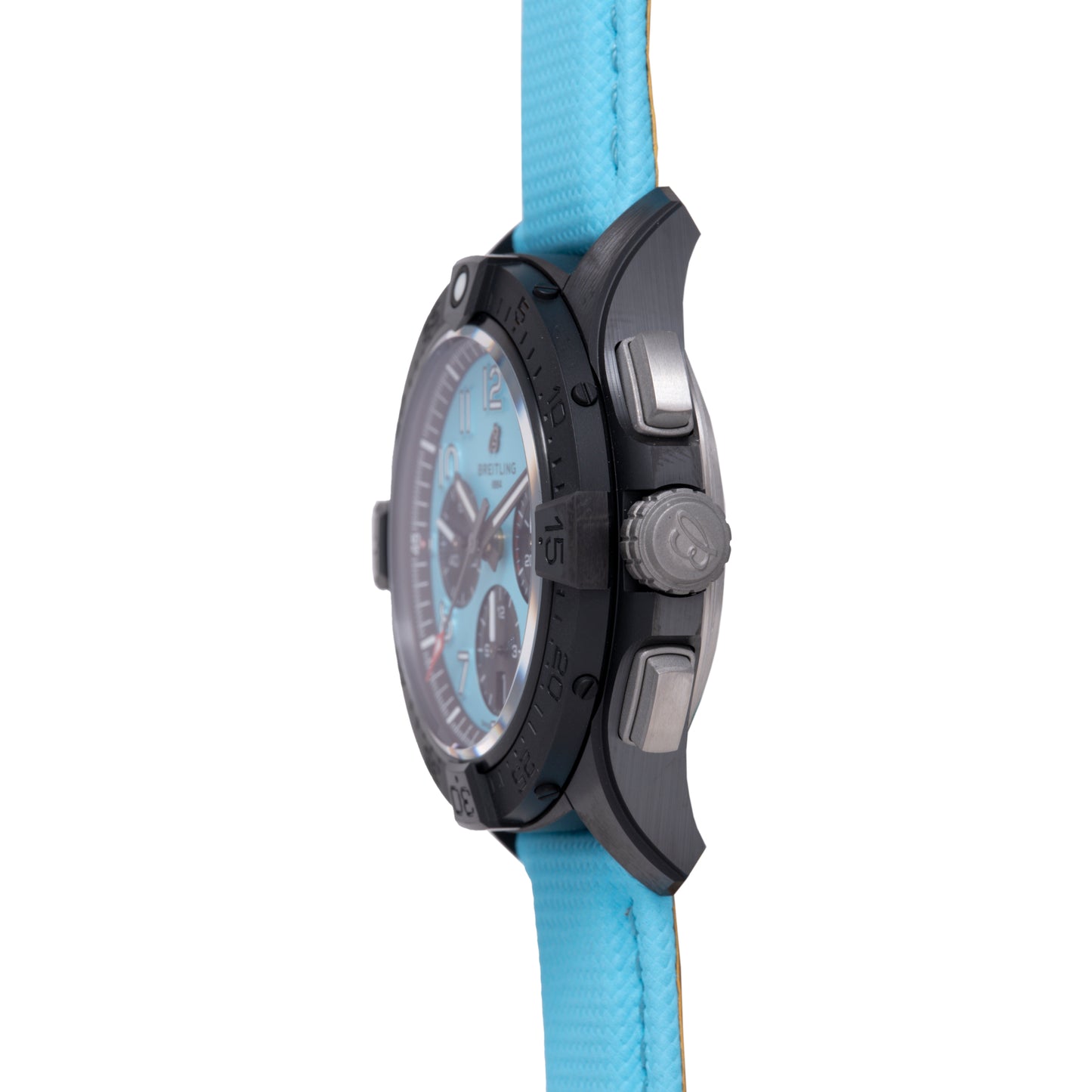 A close-up side view of the Breitling Super Avenger B01 Chronograph 42 shows its black case, light blue dial, and textured matching strap, with prominent buttons and a crown on the right side.