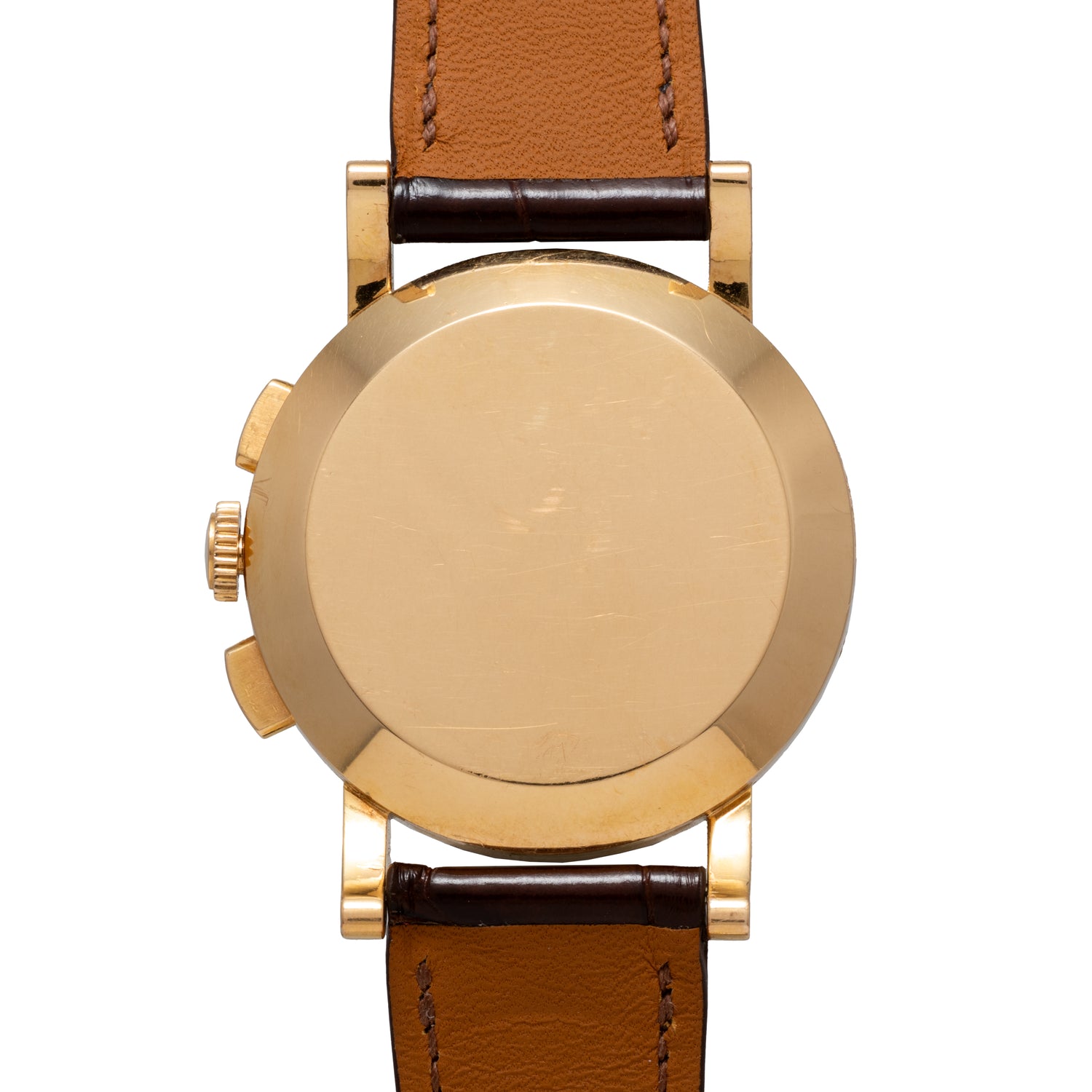 A close-up of the back of the Omega French Market Chronograph 'Calibre 321' with a brown leather strap reveals its unmarked gold case, underscoring a timeless design and housing the iconic Omega Calibre 321 chronograph movement inside.