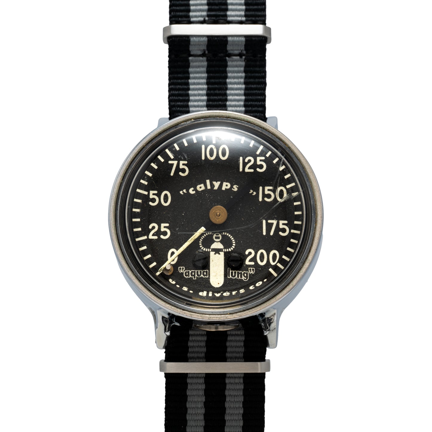 The Calypso Depth Gauge by Calypso is a vintage divers watch with a mechanical depth gauge on its black dial, white numbers, 0–200 display, single central hand, and a black-and-grey striped fabric strap—ideal for scuba diving.