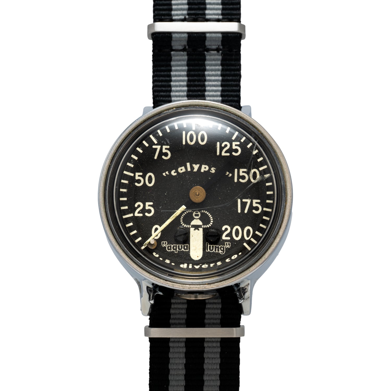 The Calypso Depth Gauge by Calypso is a vintage divers watch with a mechanical depth gauge on its black dial, white numbers, 0–200 display, single central hand, and a black-and-grey striped fabric strap—ideal for scuba diving.