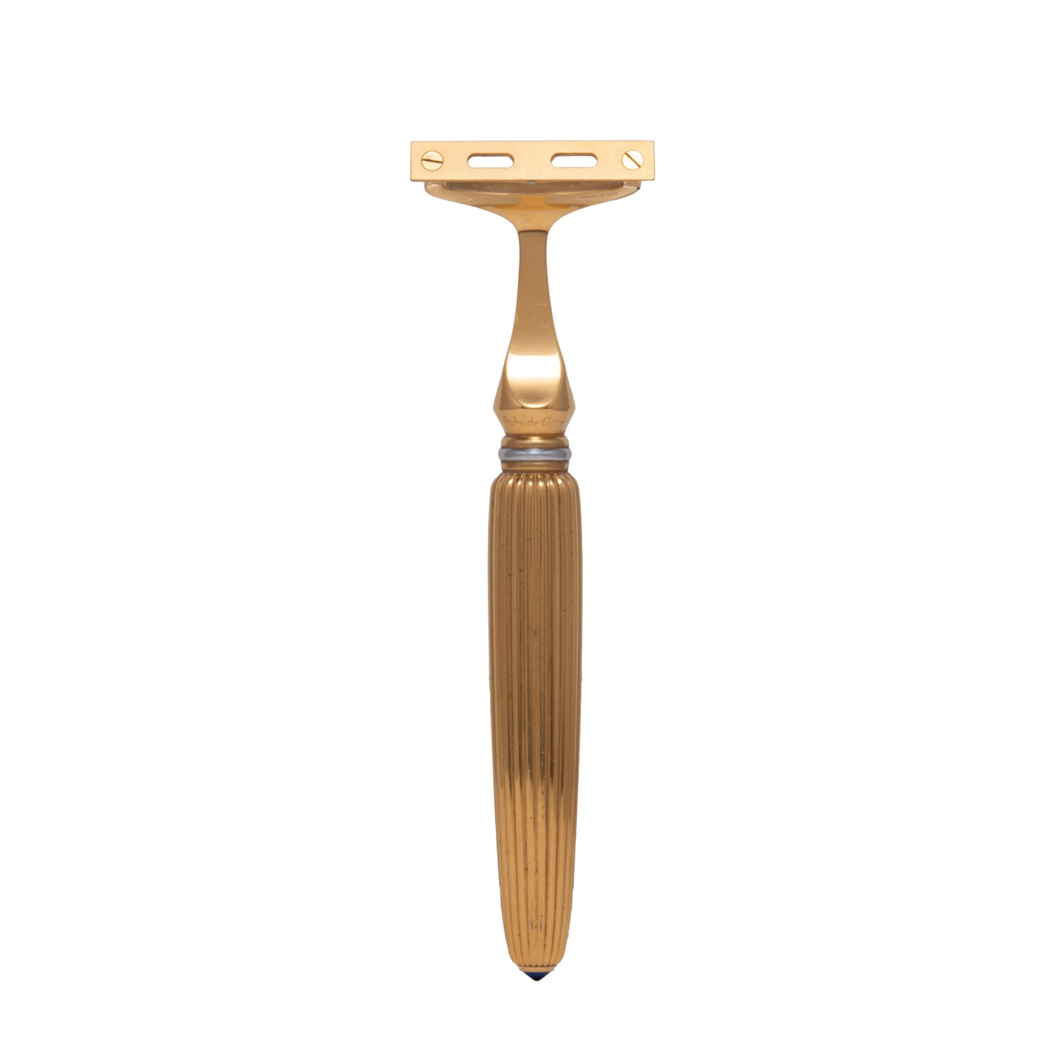 The Cartier Pasha de Cartier Razor by Cartier is an 18K gold-plated grooming tool with a textured, fluted handle, shown standing upright against a plain white background.
