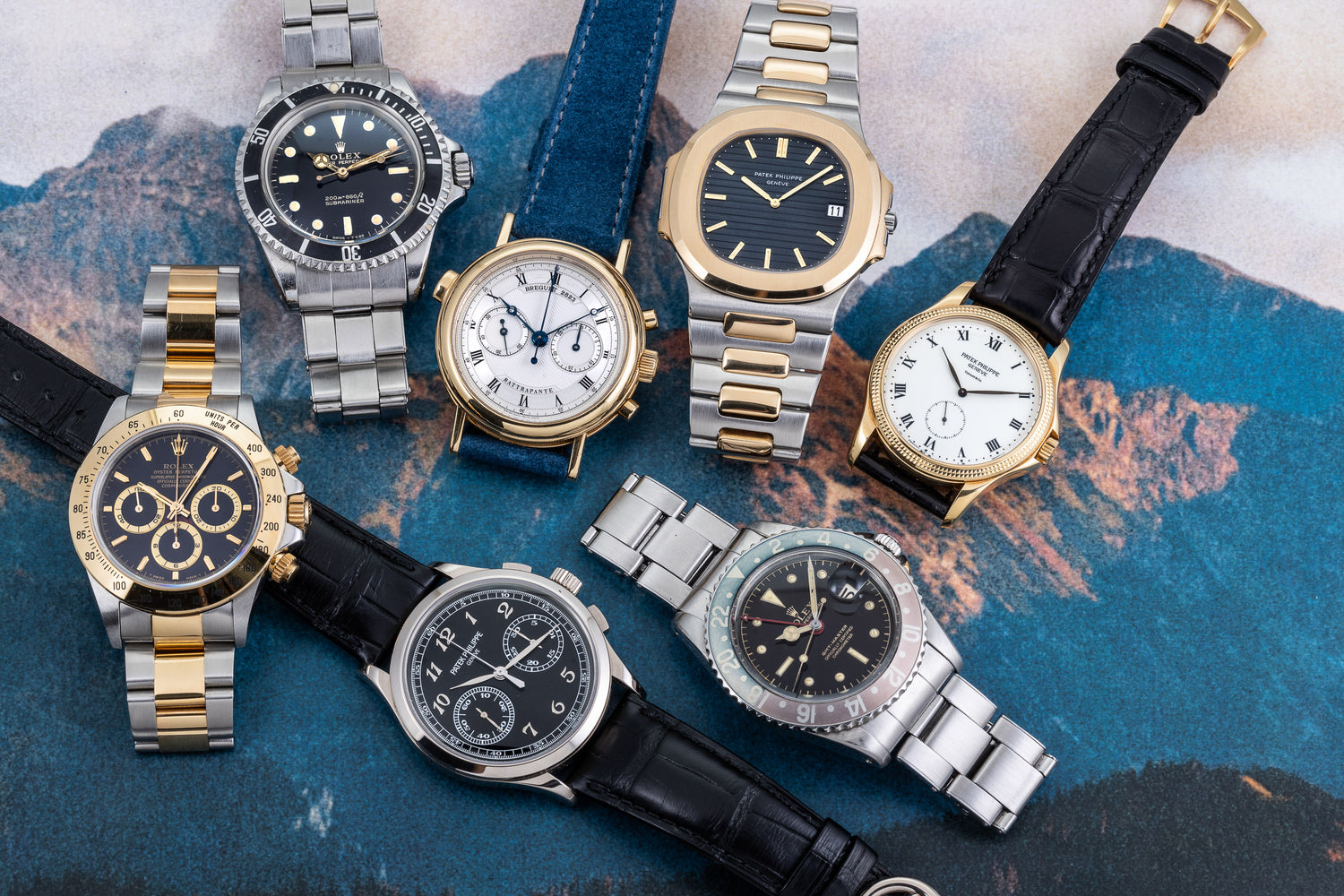Group of vintage watches laying on background