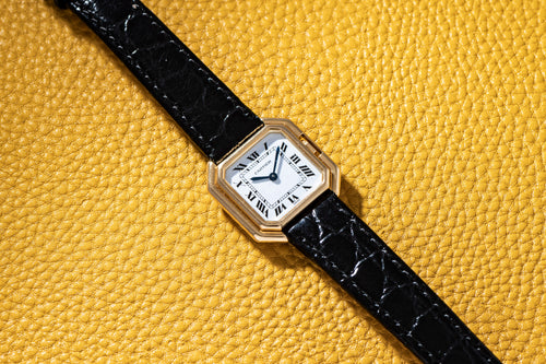 24 mm yellow-gold Ceinture on a black strap with a gloss white Roman dial signed Swiss, late 1980s. · Photo: Analog:Shift · © Analog:Shift, used with permission · Source: https://www.analogshift.com/products/cartier-ceinture-as08050